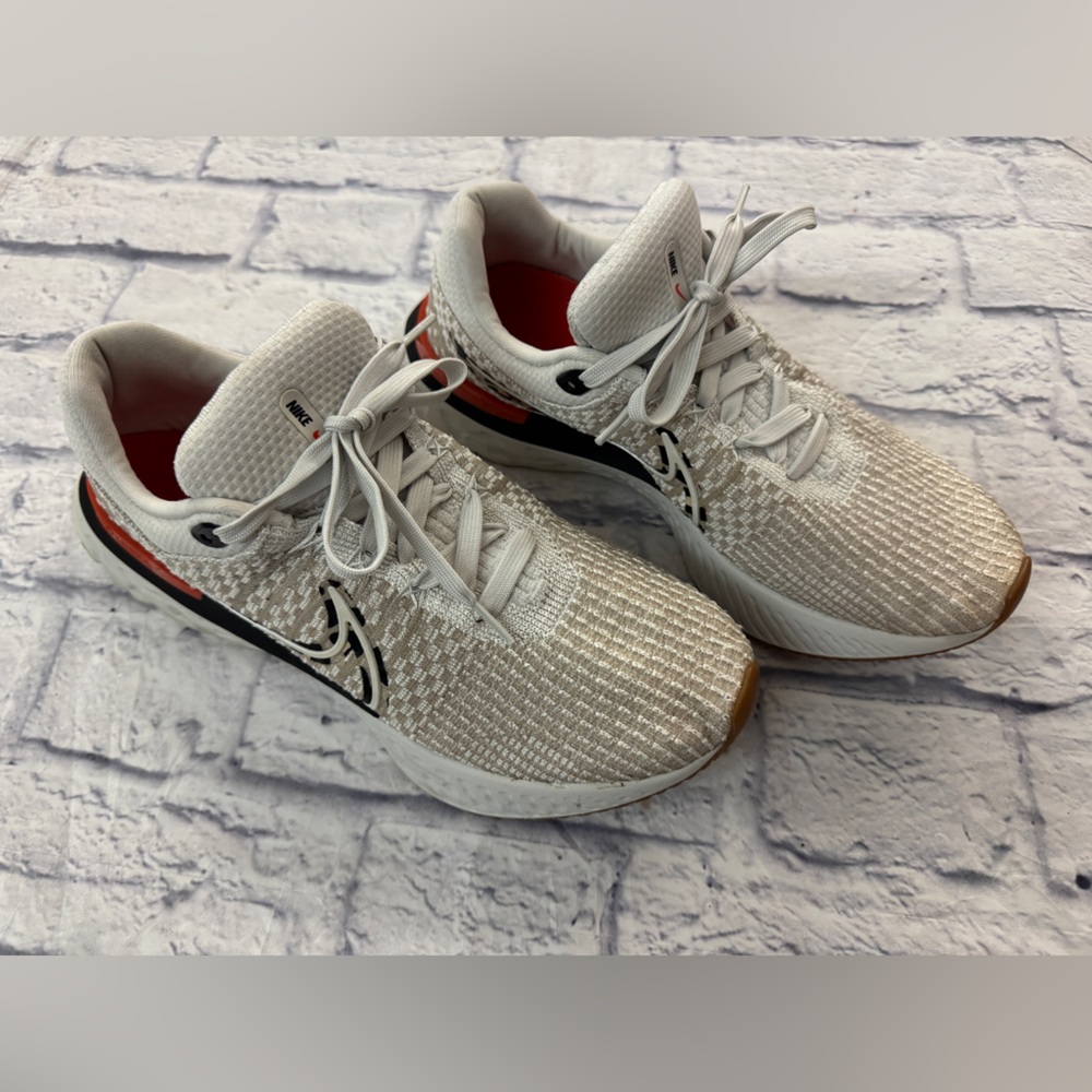 Nike React Infinity Run ladies sz 11.5 Orange, oatmeal and black Athletic Shoes.